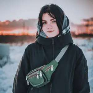 woman in the CT Shoreline wearing a dog walking bag A Pro Dog Walker's Perspective on Dog Walking Bags