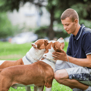 teenager with two dogs in the CT Shoreline