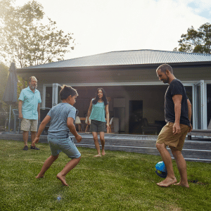 family playing outside a CT Shoreline home