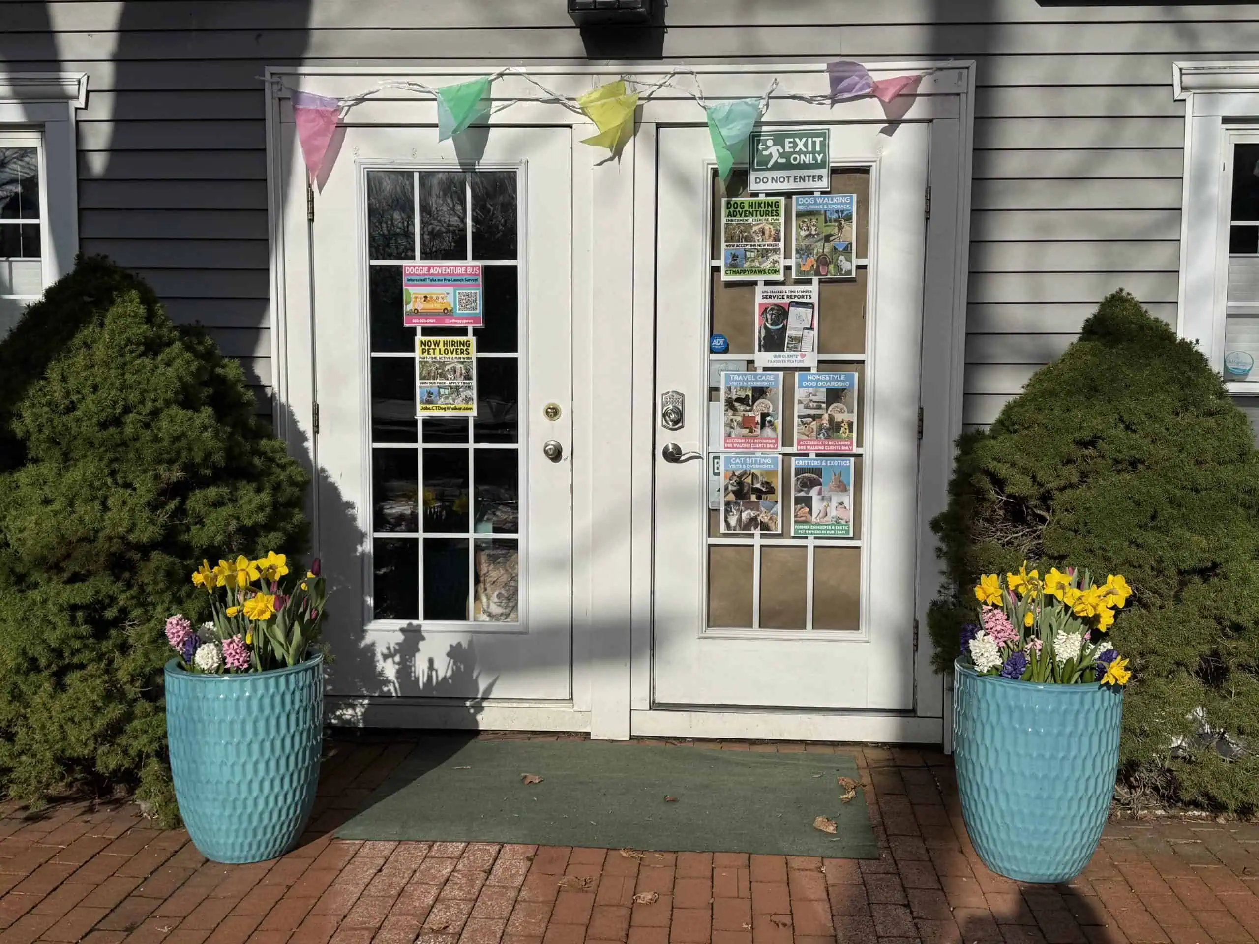 Shoreline Happy Paws office storefront in spring - dog walking Old Saybrook