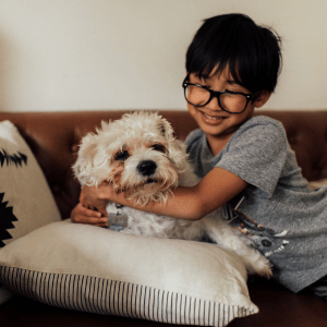 Back-to-School Dog Walking Tips for Connecticut Shoreline Pet Parents 5 child with a dog in an Old Saybrook, CT home
